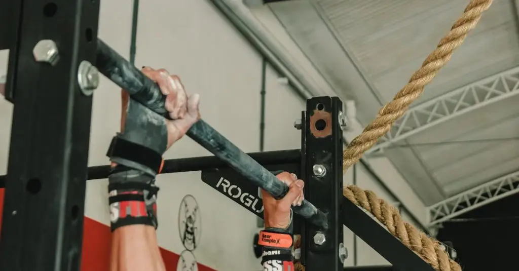Close-up of hands gripping pull-up bar during an intense gym workout session.